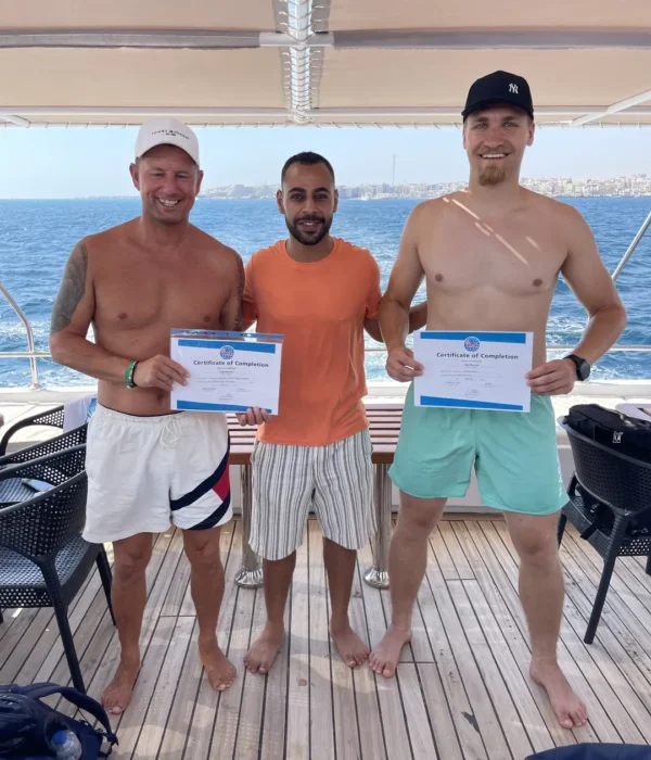 PADI Advanced Open Water Course in Hurghada - Happy students with their instructor on a diving boat, Red Sea