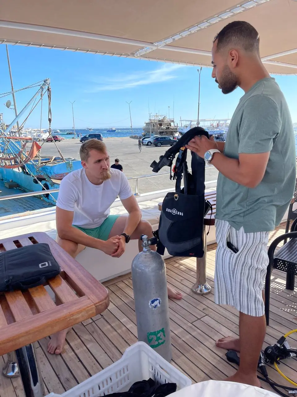 PADI Open Water Diver Course Hurghada - Instructor explaining scuba equipment to a student with Diving Mentor.